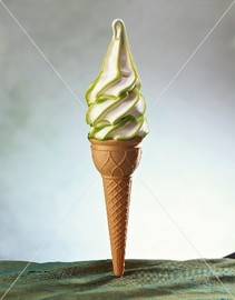 Soft vanilla ice cream cone with lime sauce on it
